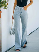 Pantaloni in denim lavato con spacco all'orlo