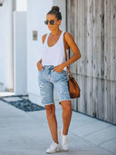 Shorts di jeans slim fit consumati con orlo sfrangiato
