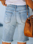 Shorts di jeans slim fit consumati con orlo sfrangiato