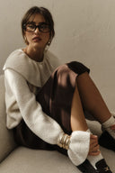 Pullover in warmem Ton mit Rüschen
