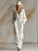Tuta casual larga alla moda in velluto a coste bianco con cappuccio, zip frontale e maniche lunghe