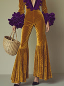Modefest lilla flæse jumpsuit med lange ærmer, vidde og gyldent fløjl